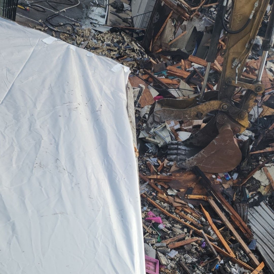 Photo of demolition progress after TX apartment fire