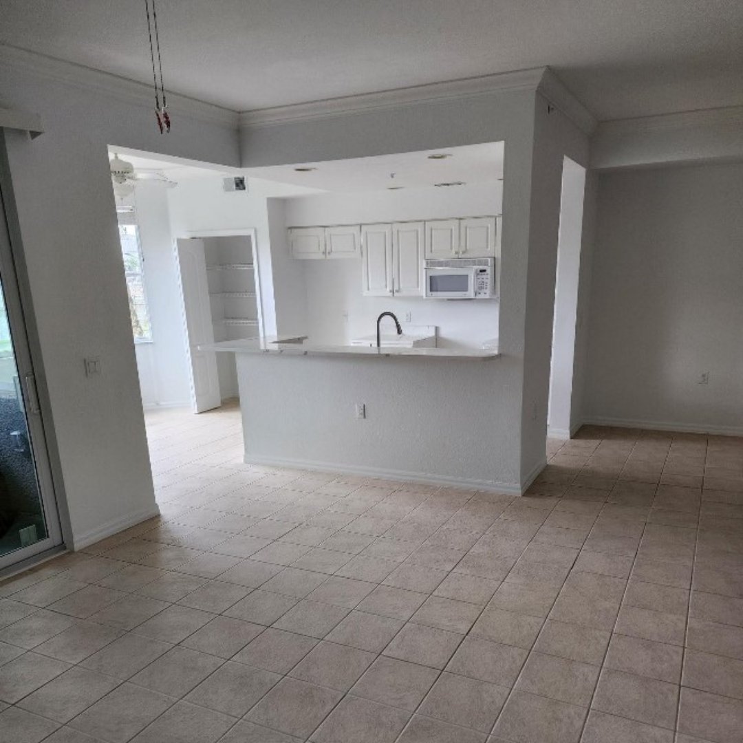 Living room and kitchen of condo after CRC provided reconstruction to water damaged building