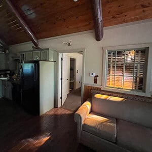 Living room area of remote log cabin following fire damage and flooding restoration performed by CRC 