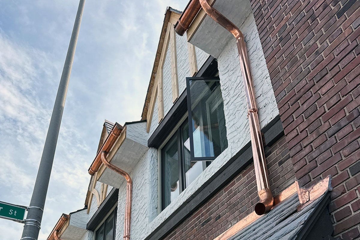 New-copper-gutters-and-downspouts-on-Manchester-Apts