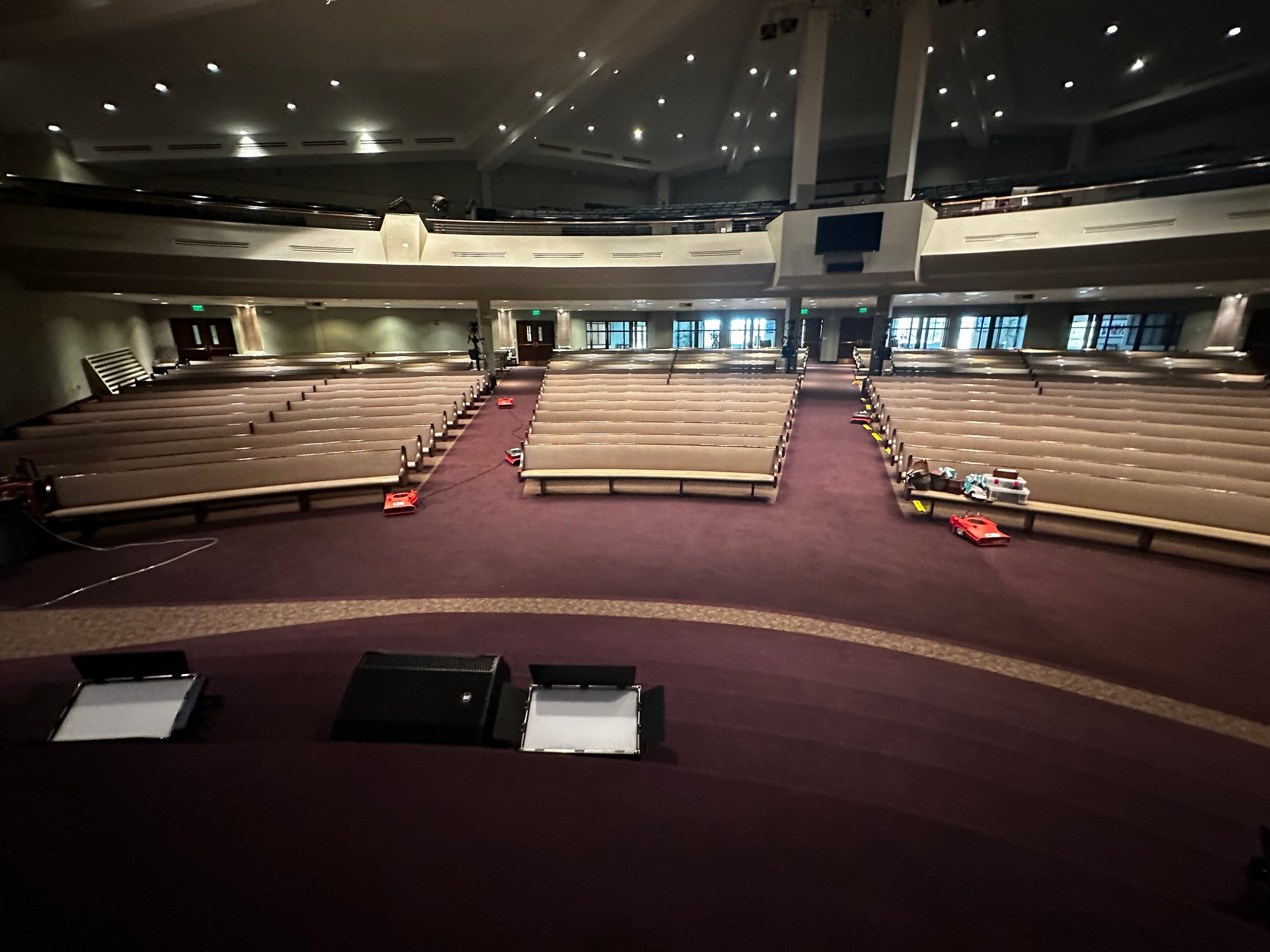 Image of church auditorium being dried by commercial reconstruction equipment after church faced severe flooding