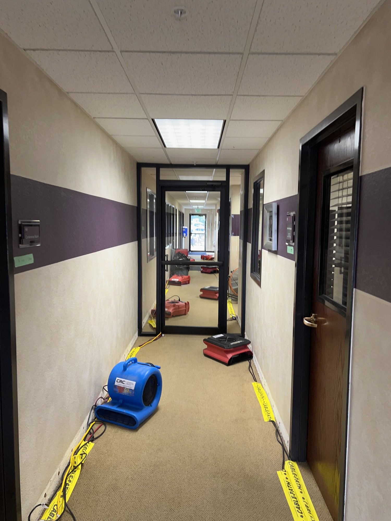 Church hallway being dried using commercial drying equipment after the church faced flooding due to pipe burst
