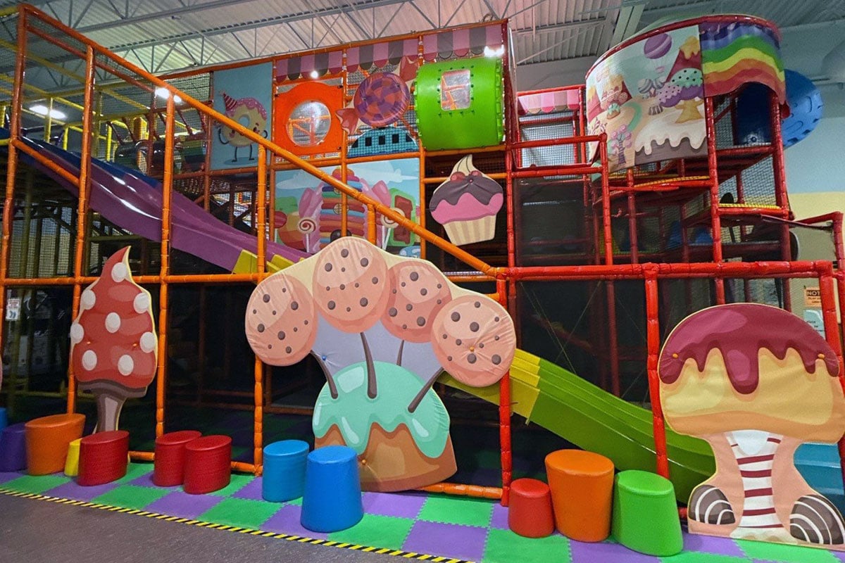 Play structure in indoor play facility with candy theme.