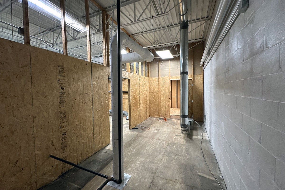 Plywood walls in storage area after fire.