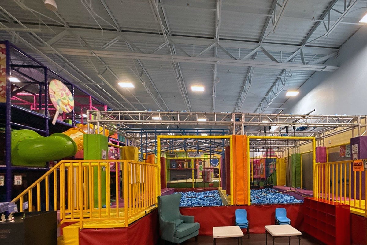 Ball pit and slides in indoor play facility.