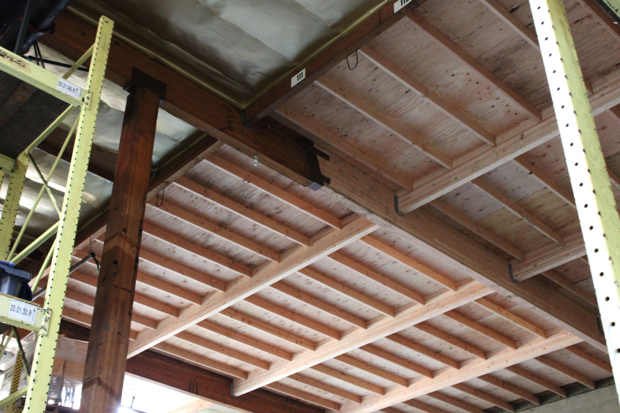 Warehouse roof repair after storm damage.